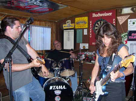 Mick, Rich
                                                        and Charley play
                                                        the blues at
                                                        Open Mic at Big
                                                        Johns Pub