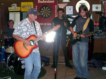 Mick, Rich
                                                        and Charley play
                                                        the blues at
                                                        Open Mic at Big
                                                        Johns Pub