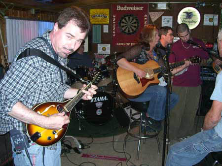 Mick, Rich
                                                        and Charley play
                                                        the blues at
                                                        Open Mic at Big
                                                        Johns Pub