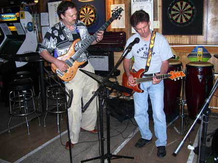 Mick, Rich
                                                        and Charley play
                                                        the blues at
                                                        Open Mic at Big
                                                        Johns Pub